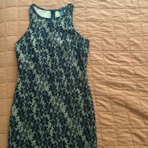 Forever mini dress tan color with black lace overlay. Medium size